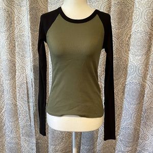 Small green and black tee shirt.